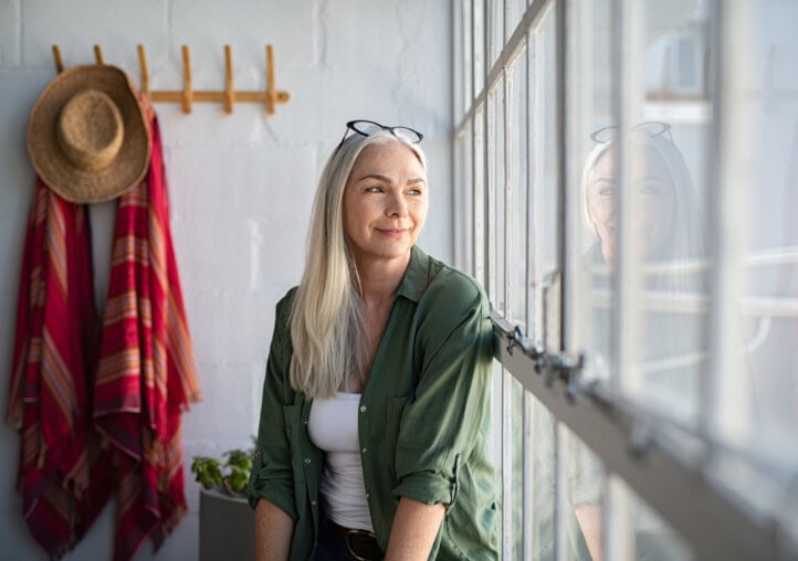 happy mature woman thinking