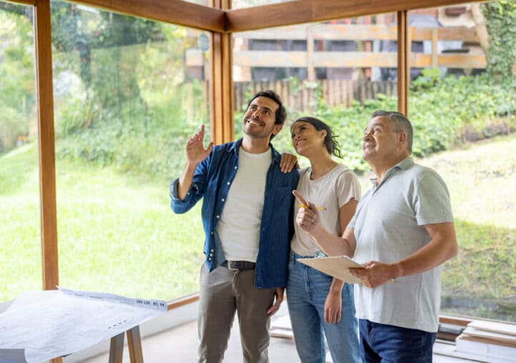 architect renovating a house and discussing ideas with the owners
